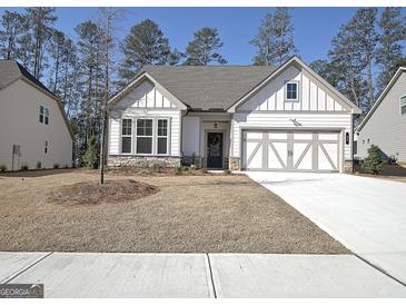 Charming single-Gathering home with a two-car garage and inviting curb appeal in a serene neighborhood at 82 Airmont Dr, Sharpsburg, GA 30277