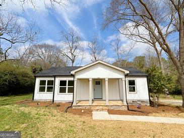Charming renovated single-story home with a welcoming front porch and a well-manicured lawn at 299 Lagrange St, Grantville, GA 30220