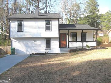 Charming two-story home with a welcoming front porch and a well-maintained yard at 5017 Galbraith Cir, Stone Mountain, GA 30088