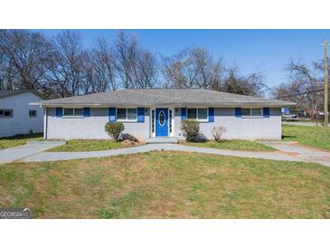 Single-story home with blue trim, including shutters and front door at 1393 Vesta Ave, Atlanta, GA 30344