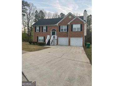 Charming two-story brick home with a two-car garage and inviting front porch at 3731 Patti Pkwy, Decatur, GA 30034
