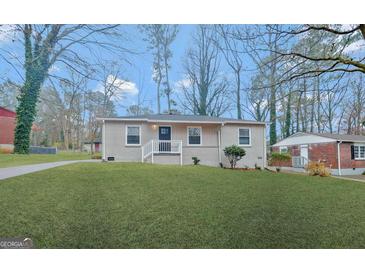 Charming single-story home with manicured lawn and inviting front porch at 263 Banberry Se Dr, Atlanta, GA 30315
