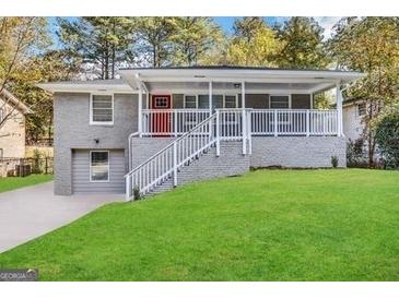 Charming single-story home with a lovely front porch and well-maintained lawn and driveway at 619 Church Nw St, Atlanta, GA 30318