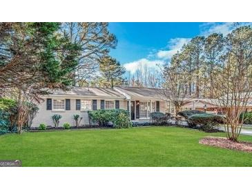Charming single-story home with well-maintained lawn and mature trees providing shade at 2509 Appomattox Dr, Decatur, GA 30034