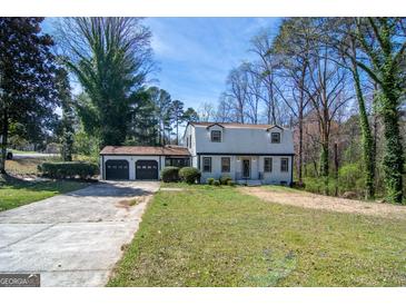 Charming two-story home featuring a spacious front yard and a three-car garage at 2282 Tiffany Ct, Jonesboro, GA 30236