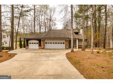 Charming home with a three-car garage, and a long driveway at 171 Rockspray Rdg, Peachtree City, GA 30269