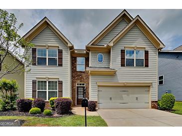 Charming two-story home with landscaped front yard and attached two-car garage at 461 Best Friends Turn Aly, Mcdonough, GA 30252