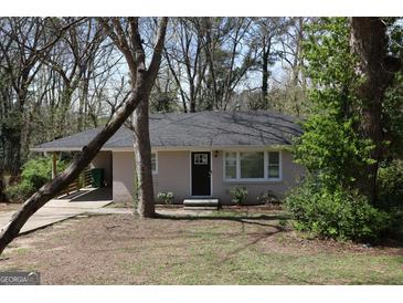 Charming single-story home with a well-manicured front yard, offering a welcoming curb appeal at 2823 Horse Shoe Dr, Atlanta, GA 30316