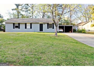Charming single-story home with a well-maintained lawn and inviting curb appeal at 2900 Haddon Dr, Rex, GA 30273