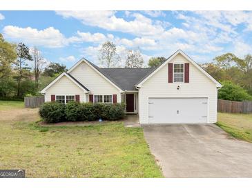 Charming single-Gathering home featuring a two-car garage, landscaped front yard, and a classic design at 1416 Flanagan Mill Dr, Auburn, GA 30011