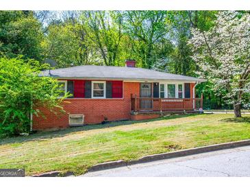 Charming red-brick home with well-manicured front lawn and mature trees at 3614 Fairburn Nw Pl, Atlanta, GA 30331
