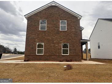 Two-story brick home featuring white trim and a well-maintained yard at 5301 Tolar Rd # 95, South Fulton, GA 30213