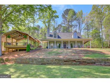 Charming single-Gathering home featuring a covered porch and a detached pavilion, perfect for outdoor entertaining at 40 Butler Bridge Dr, Mcdonough, GA 30252