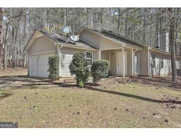 Charming single-story home with a well-maintained yard and attached garage at 1109 Allen Rd, Grantville, GA 30220