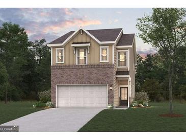 Charming two-story home with a brick facade and a two-car garage nestled on a lush green lawn at 1020 Sutherland Lane # 41, Lawrenceville, GA 30043