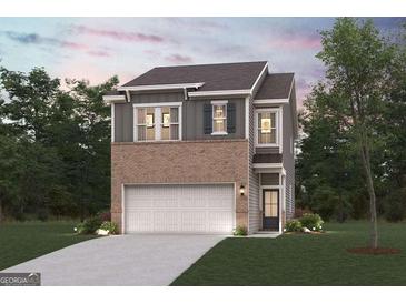 Charming two-story home with a brick and gray exterior and attached two car garage at 1020 Sutherland Lane # 43, Lawrenceville, GA 30043