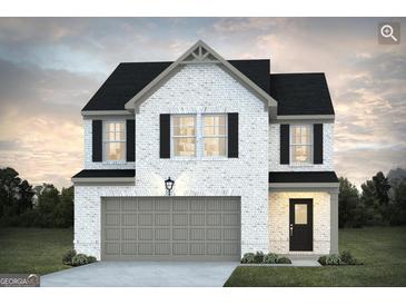 Charming two-story home with white brick, black shutters, and a two-car garage at 5389 Tolar Road # 36, South Fulton, GA 30213