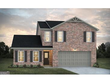 Charming two-story brick home featuring a two-car garage, black shutters, and a well-maintained lawn at 5360 Tolar Rd # 72, South Fulton, GA 30213