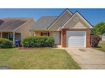 Charming single Gathering home with a one car garage and a well maintained lawn at 20 Highgate Trl, Covington, GA 30016