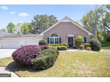 Charming brick home with well-manicured landscaping and a two-car garage at 3417 Double Eagle Dr # Bldg 31, Marietta, GA 30008