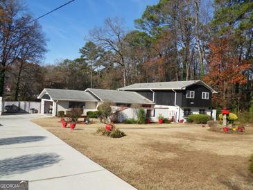 Charming exterior view of a two-story home featuring a well-maintained front yard and inviting curb appeal at 4213 Janice Drive, Atlanta, GA 30337