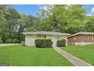 Charming single-story home featuring a manicured lawn and inviting front entrance at 2155 Meador Se Ave, Atlanta, GA 30315