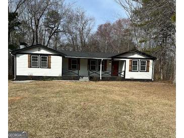 Charming single-story home with a well-maintained front yard and cozy curb appeal at 5949 Tyree Rd, Winston, GA 30187
