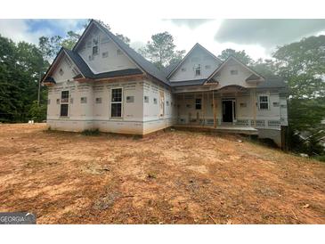 New construction home with a covered porch and modern architectural design at 2012 Lakeview Pkwy, Villa Rica, GA 30180