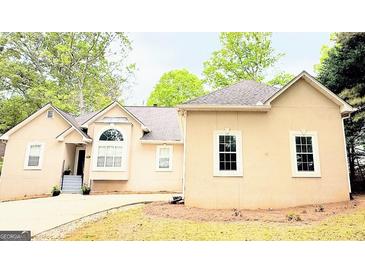 Charming single-story home with a well-manicured lawn and inviting curb appeal at 1252 Heritage Dr, Villa Rica, GA 30180