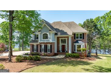 Spacious two-story home with a well-kept lawn and mature trees at 513 Viridian Vw, Peachtree City, GA 30269