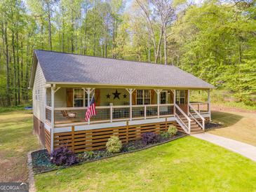 Charming single-story home featuring a spacious front porch, craftsman details, and a well-maintained lawn at 120 Trisha Ln, Grantville, GA 30220