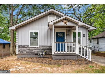 Charming single-story home with a welcoming front porch and attractive curb appeal at 3378 La Vista, Hapeville, GA 30354