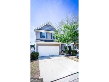 Charming two-story home featuring a two-car garage and well-maintained landscaping at 386 Hill Crest Cir, Hiram, GA 30141