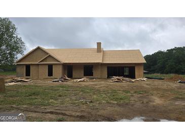 Unfinished exterior of a home with a roof and chimney at 3219 Broadnax Mill Rd # 5, Loganville, GA 30052