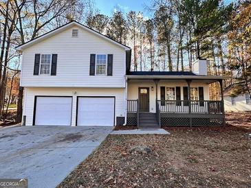 Charming split-level home with a covered front porch and two-car garage at 473 Amy Blvd, Temple, GA 30179