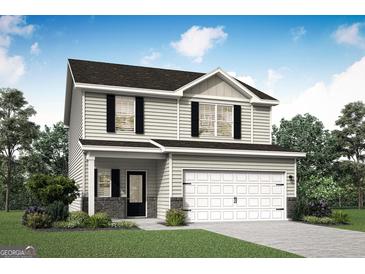 Charming two-story home with stone accents, black shutters, and a two-car garage at 455 Prescott Way, Villa Rica, GA 30180