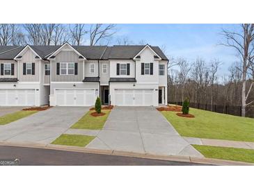 New townhomes feature Craftsman-style exteriors and attached garages in a desirable community at 326 Sound Cir # 119, Stockbridge, GA 30281