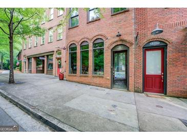 Charming brick building exterior with well-maintained sidewalk and inviting entrance at 4173 Raphael St, Covington, GA 30014