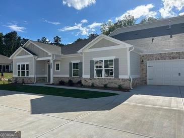 Charming single-story home featuring a brick facade, neutral siding, and an attached two-car garage at 3706 Cheswoilde Ave # 96, Powder Springs, GA 30127