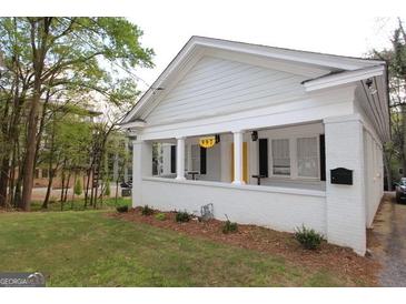 Charming single-story home with a welcoming front porch and well-maintained landscaping at 997 Boulevard Se, Atlanta, GA 30312