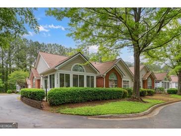 Charming single story home featuring well-maintained landscaping and an inviting facade at 3746 Vineyards Lake Nw Cir # U6, Kennesaw, GA 30144