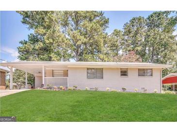 Charming single-story home with a well-manicured lawn and covered entry at 2610 Preston Dr, Decatur, GA 30034