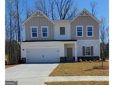 Charming two-story home featuring a spacious two-car garage and neutral color scheme at 99 Cooperton, Villa Rica, GA 30180