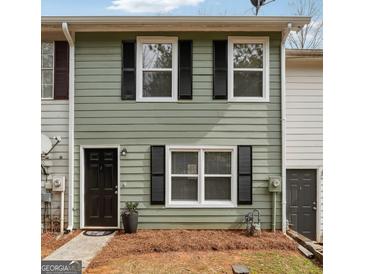 Charming two-story home with black shutters, a black front door, and a manicured lawn at 4282 Worth Nw St, Acworth, GA 30101