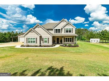 Charming two-story home with manicured front yard and lush green lawn at 107 Corinth Reserve Pl, Grantville, GA 30220