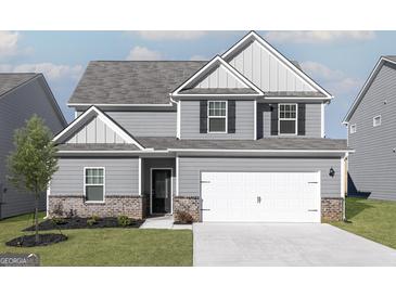 Charming two-story home with gray siding, white trim, and an attached two-car garage at 438 Prescott Way, Villa Rica, GA 30180