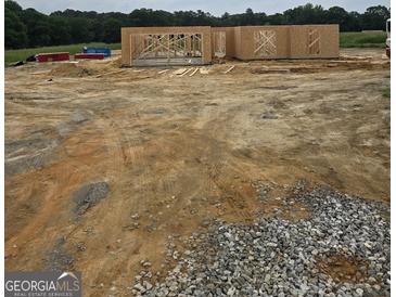 New home construction showing framing on a large lot at 3269 Broadnax Mill Rd # 1, Loganville, GA 30052