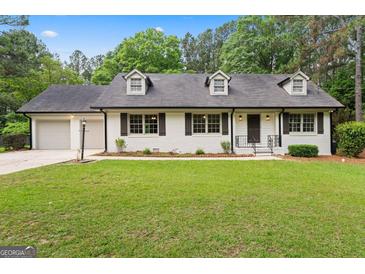 Charming one-story home with a well-manicured lawn and inviting curb appeal at 380 Grady Ave, Fayetteville, GA 30214