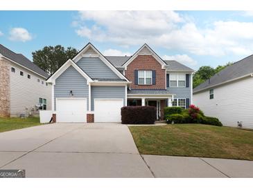 Charming two-story home with a well-maintained lawn and attached two-car garage at 1144 Simonton Hill Ct, Lawrenceville, GA 30045