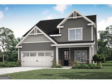 Charming two-story home featuring a welcoming front porch, two-car garage, and beautifully landscaped yard at 531 Cantrell Drive, Dallas, GA 30157